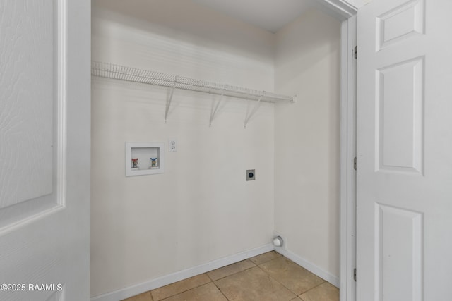 laundry room with light tile patterned floors, laundry area, baseboards, hookup for a washing machine, and electric dryer hookup