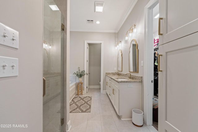 bathroom featuring vanity, visible vents, tile patterned floors, a stall shower, and crown molding