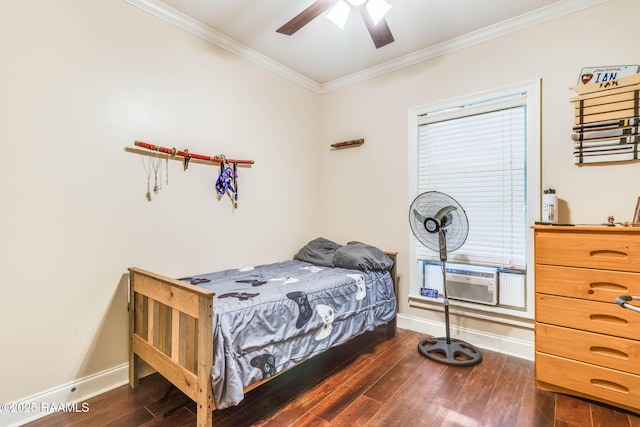 bedroom featuring dark wood-style floors, ornamental molding, and baseboards