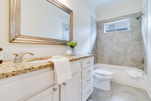 bathroom featuring toilet, vanity, crown molding, and shower / bathing tub combination