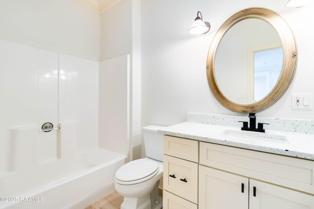 bathroom featuring shower / washtub combination, vanity, and toilet