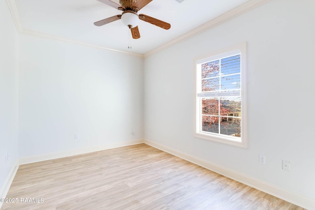 unfurnished room featuring light wood-type flooring, crown molding, baseboards, and a wealth of natural light