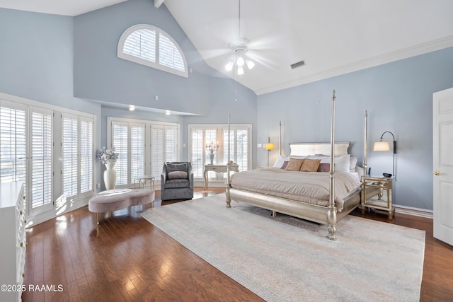 bedroom featuring high vaulted ceiling, dark wood finished floors, baseboards, and ornamental molding