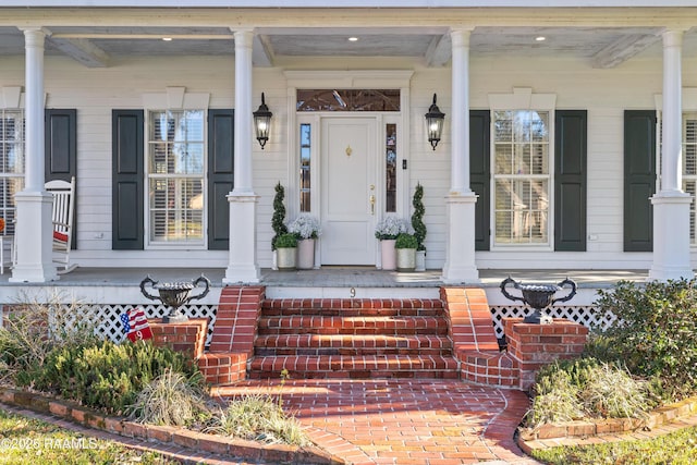 entrance to property with a porch