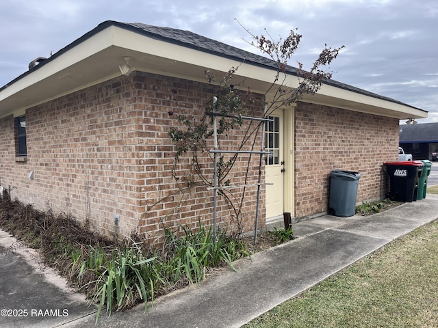 view of home's exterior with brick siding