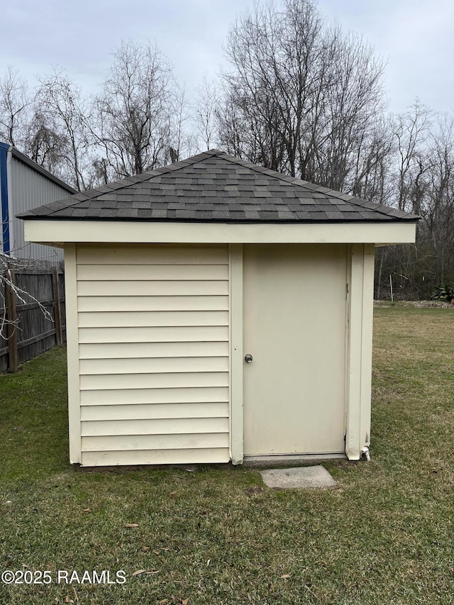 view of shed with fence