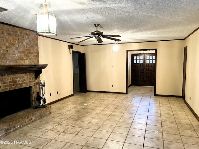 unfurnished living room featuring light tile patterned floors, a brick fireplace, ornamental molding, and a textured ceiling