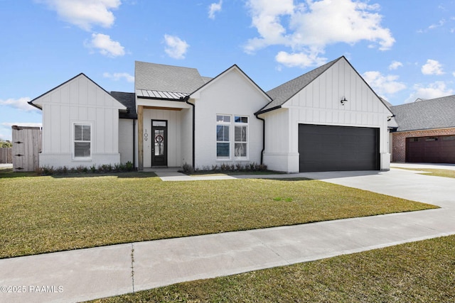 modern farmhouse with a garage, concrete driveway, a standing seam roof, board and batten siding, and a front yard