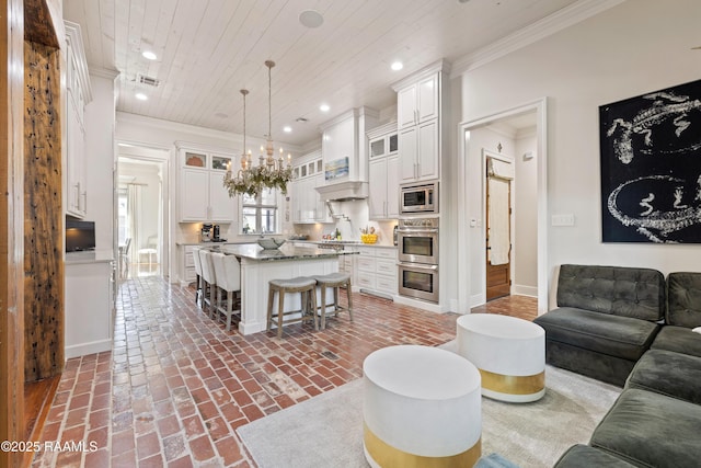 living area with baseboards, wood ceiling, ornamental molding, brick floor, and recessed lighting