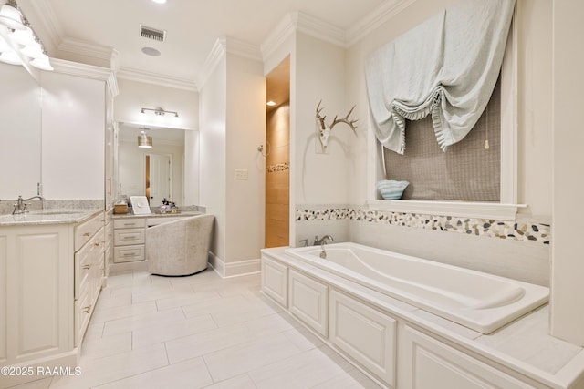 full bath with visible vents, a garden tub, tile patterned flooring, crown molding, and vanity