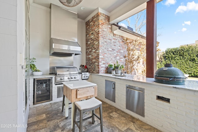 view of patio / terrace with exterior kitchen, beverage cooler, grilling area, and a sink