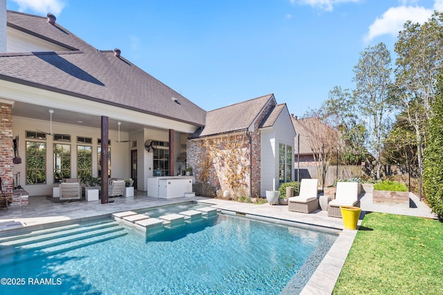 view of swimming pool with a fenced in pool, a patio area, and fence