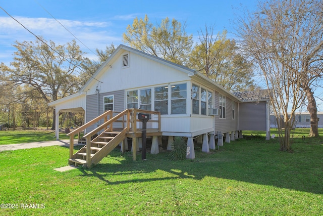 404 Senior Aly, Abbeville, LA 70510 - rear view of house with stairway, cooling unit, driveway, a yard, and a carport