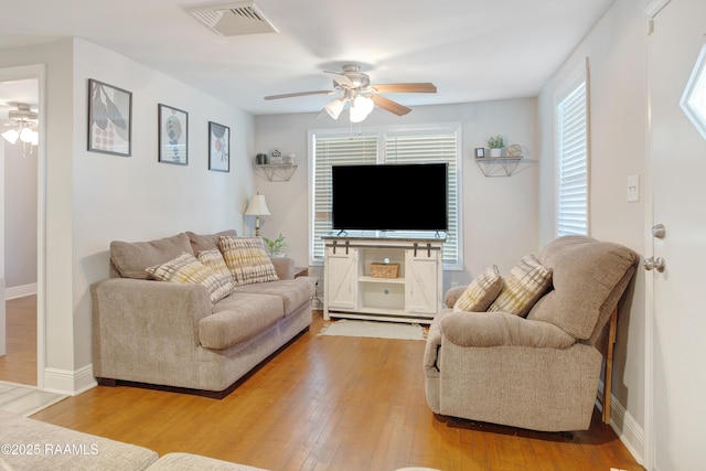 404 Senior Aly, Abbeville, LA 70510 - living room with light wood finished floors, visible vents, baseboards, and a ceiling fan