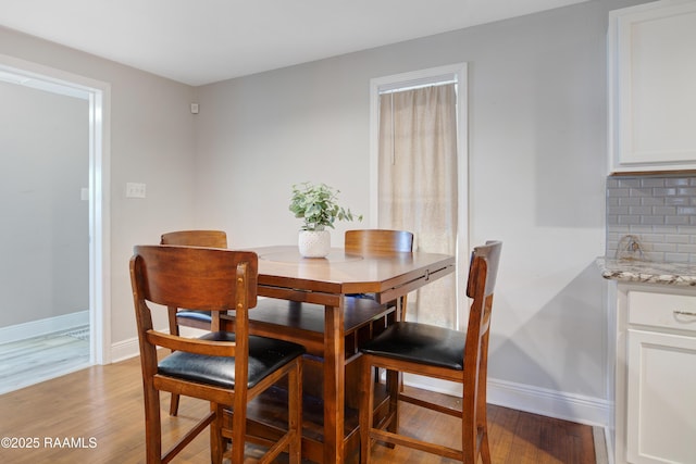 404 Senior Aly, Abbeville, LA 70510 - dining area with baseboards and light wood-style flooring