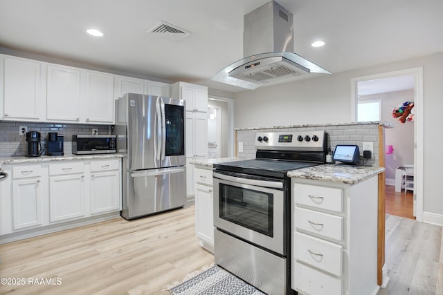 404 Senior Aly, Abbeville, LA 70510 - kitchen with light wood-style flooring, visible vents, appliances with stainless steel finishes, and island range hood