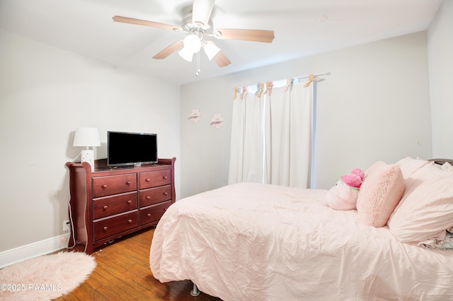 404 Senior Aly, Abbeville, LA 70510 - bedroom with a ceiling fan, baseboards, and wood finished floors