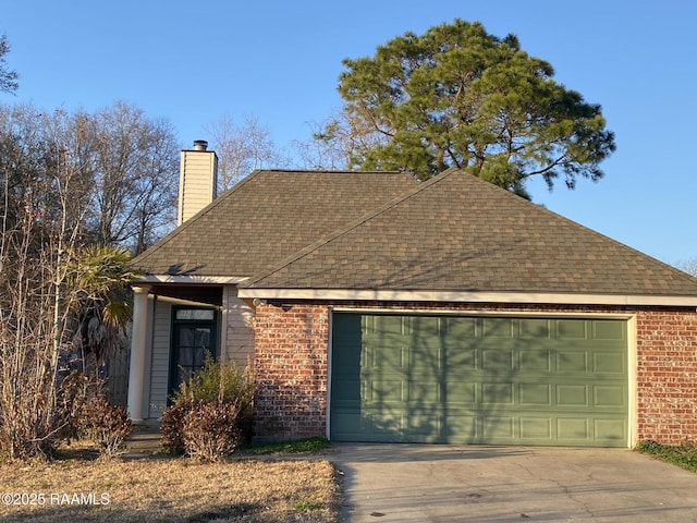 ranch-style house featuring a garage, driveway, a chimney, roof with shingles, and brick siding