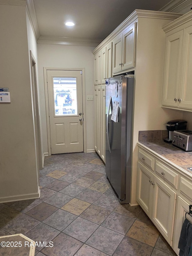 washroom featuring ornamental molding and baseboards