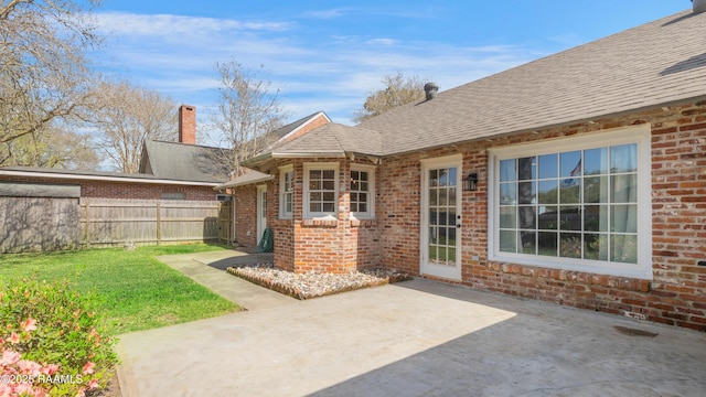 view of patio featuring fence