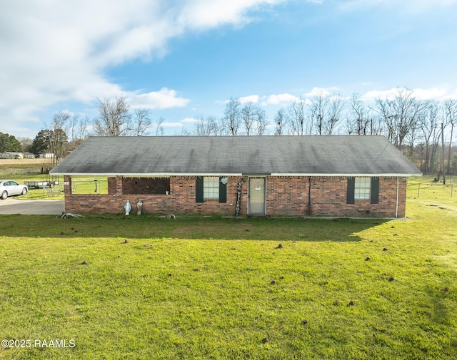 ranch-style house with brick siding and a front yard