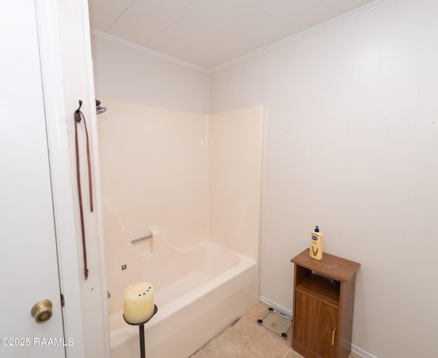 bathroom with tile patterned flooring, ornamental molding, and baseboards