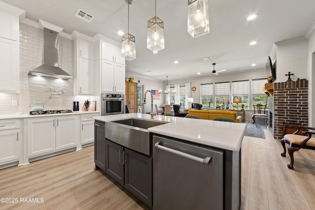 kitchen with light countertops, appliances with stainless steel finishes, and white cabinetry