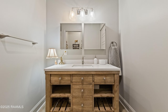 bathroom featuring vanity and baseboards