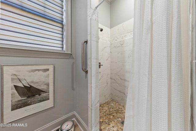 bathroom with a shower stall