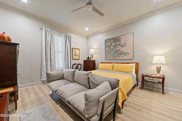 bedroom with ornamental molding, baseboards, and light wood finished floors