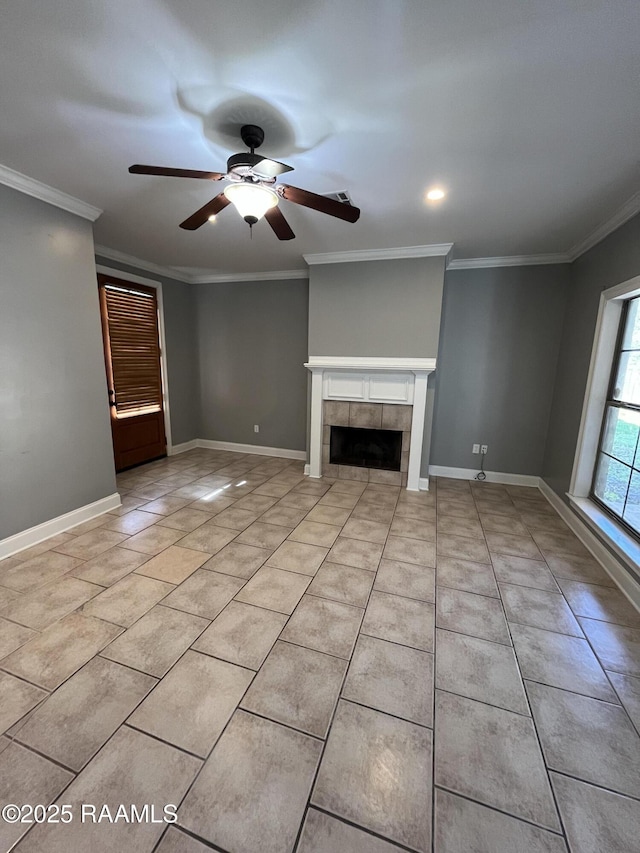 unfurnished living room with crown molding, light tile patterned flooring, a fireplace, and baseboards