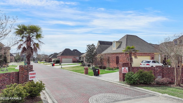 view of street with curbs and a residential view