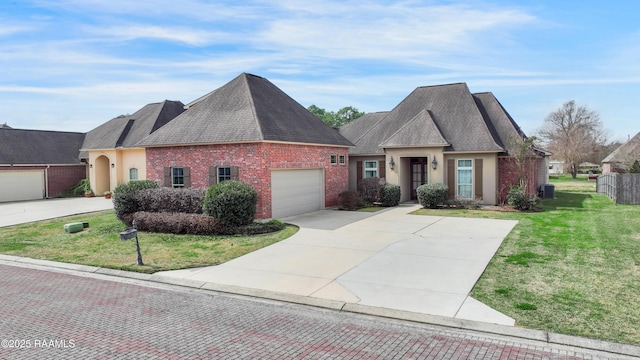 view of front facade with brick siding, stucco siding, concrete driveway, a garage, and a front lawn