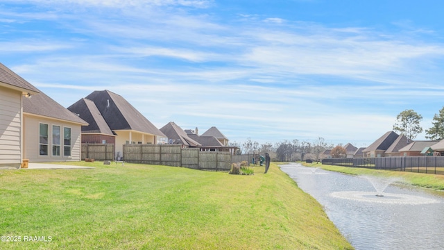 view of yard with a residential view and fence