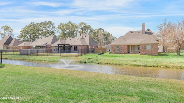 view of water feature with fence