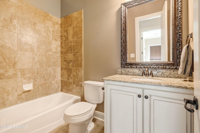 bathroom featuring bathing tub / shower combination, vanity, toilet, and baseboards