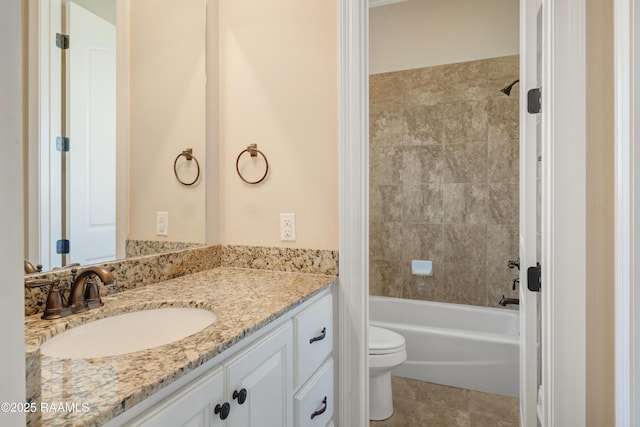 full bath featuring shower / bath combination, tile patterned flooring, vanity, and toilet