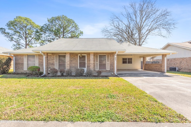 ranch-style home featuring central AC unit, an attached carport, brick siding, driveway, and a front yard