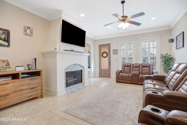 living area with crown molding, light tile patterned floors, recessed lighting, a fireplace with flush hearth, and ceiling fan