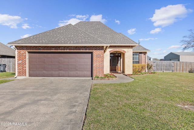 view of front of home with roof with shingles, brick siding, and a front lawn