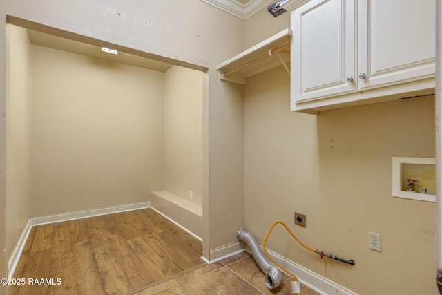 laundry area with hookup for a washing machine, cabinet space, baseboards, and hookup for an electric dryer