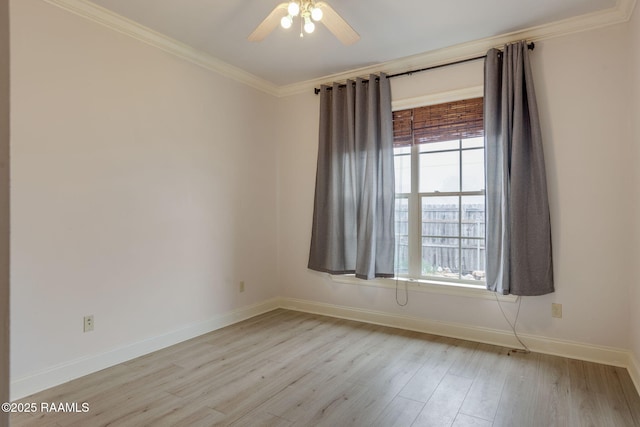 unfurnished room with crown molding, a ceiling fan, light wood-style flooring, and a healthy amount of sunlight