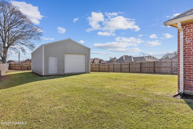 view of yard featuring a fenced backyard and an outdoor structure