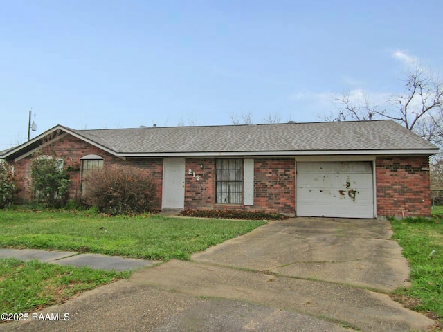 single story home with brick siding, a shingled roof, an attached garage, driveway, and a front lawn