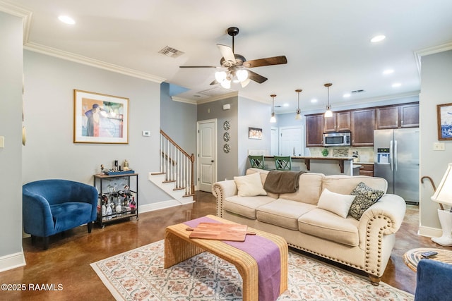 living room featuring finished concrete flooring, stairway, visible vents, and baseboards