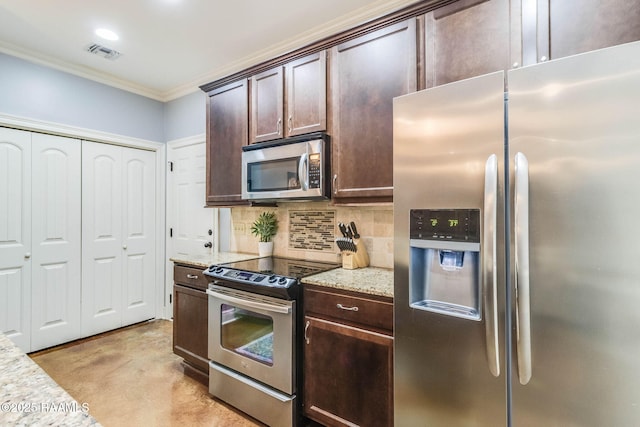 kitchen featuring dark brown cabinetry, visible vents, appliances with stainless steel finishes, and decorative backsplash