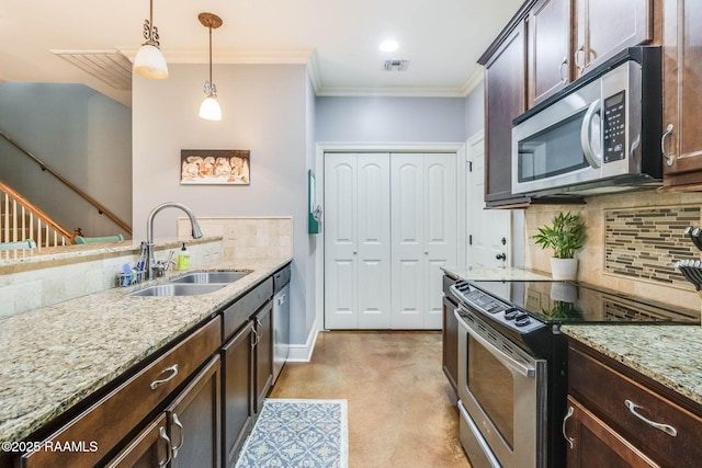 kitchen featuring visible vents, appliances with stainless steel finishes, crown molding, dark brown cabinets, and a sink