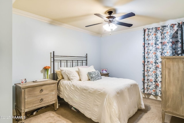 carpeted bedroom featuring a ceiling fan and crown molding