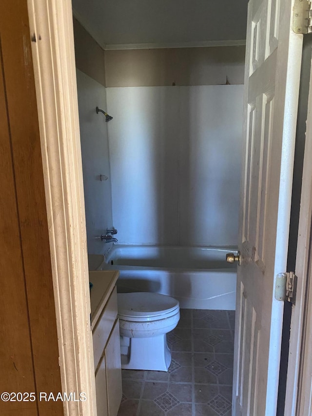 full bathroom with washtub / shower combination, vanity, toilet, and tile patterned floors