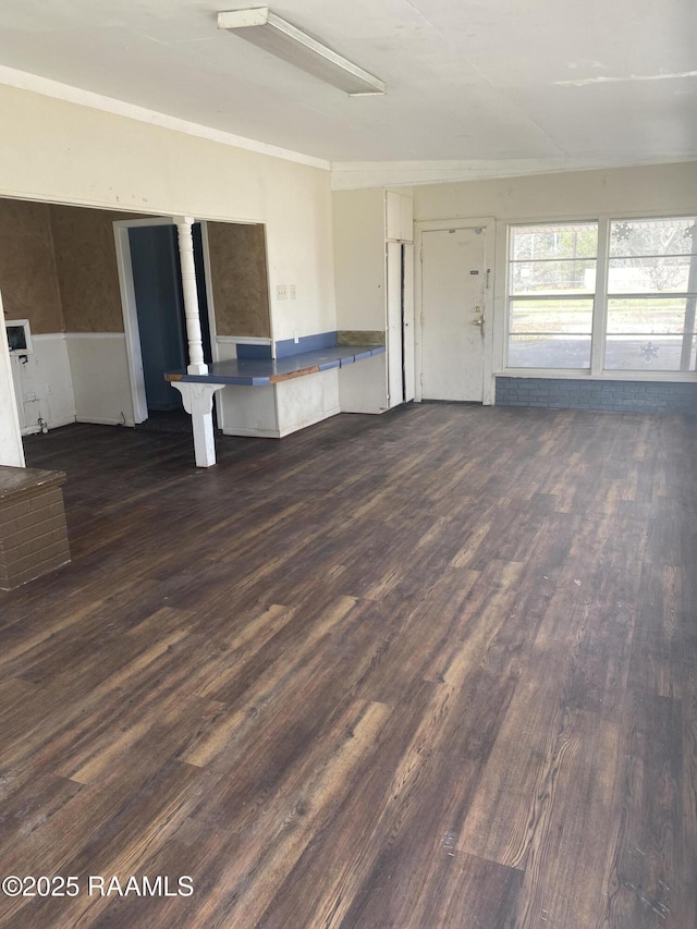 unfurnished living room with dark wood-style flooring